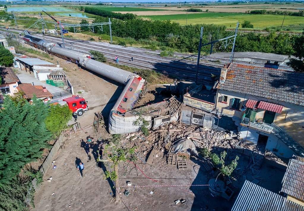 A train that derailed and hit a house.