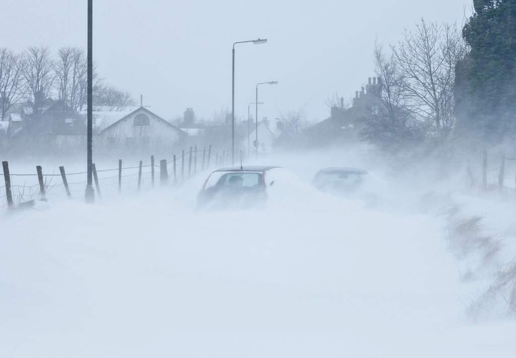 Blizzard with blowing snow makes it hard to see distance.