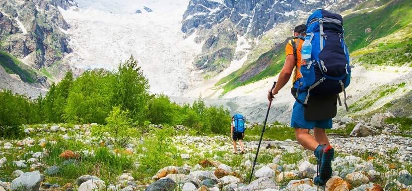 Hikers in the mountains carrying their bug-out  bags.