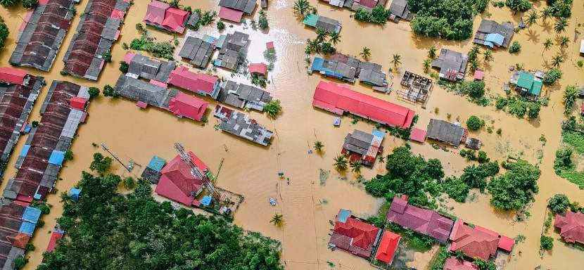 Aerial view of a small town that has been flooded.